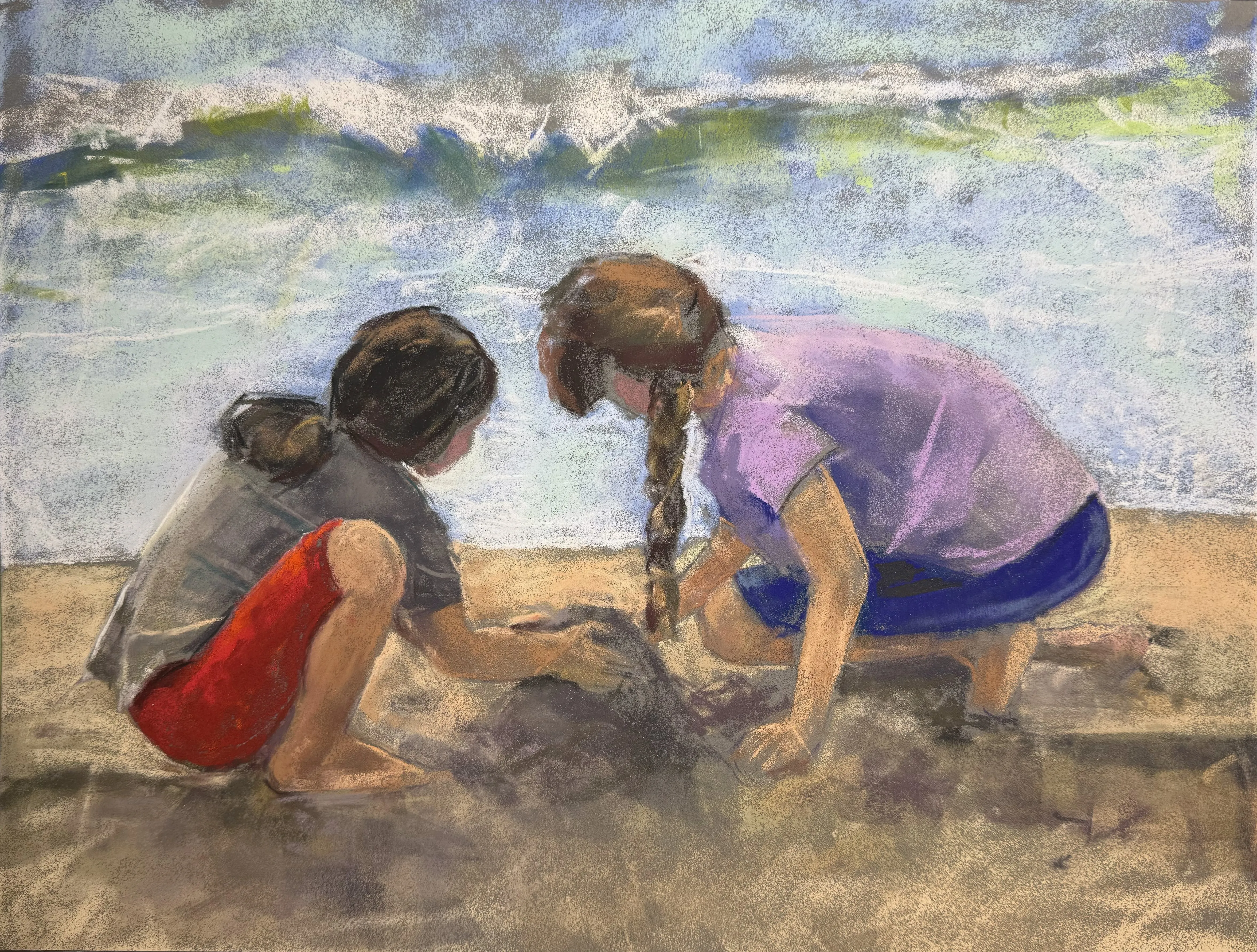 Two Girls construction castles on the beach